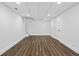 Large finished basement with vinyl floors, bright lighting, and ample space for activities at 2130 Waters Ferry Dr, Lawrenceville, GA 30043