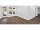 Spacious basement features wood-look flooring, natural light, and access to the outdoors at 2130 Waters Ferry Dr, Lawrenceville, GA 30043