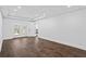 Finished basement with patio doors, vinyl floors, and ample space for recreation at 2130 Waters Ferry Dr, Lawrenceville, GA 30043