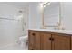 Bathroom featuring a modern double vanity, sleek walk-in shower, complemented by modern white tile and natural light at 2130 Waters Ferry Dr, Lawrenceville, GA 30043