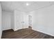 This bedroom features a double door closet, wood-look floors and recessed ceiling light at 2130 Waters Ferry Dr, Lawrenceville, GA 30043