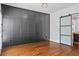Dining room featuring wood floors, wainscoting, and a glass sliding door at 2130 Waters Ferry Dr, Lawrenceville, GA 30043