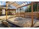 Landscaped fire pit area complemented by a pergola, basketball court, and covered patio at 2130 Waters Ferry Dr, Lawrenceville, GA 30043