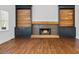 Beautiful living room with hardwood floors, fireplace and built-in shelving units at 2130 Waters Ferry Dr, Lawrenceville, GA 30043