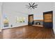 Bright living room with hardwood floors, vaulted ceiling, fireplace, and access to the outdoor deck at 2130 Waters Ferry Dr, Lawrenceville, GA 30043