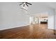 Open-concept living space with hardwood floors, vaulted ceilings, and seamless flow to kitchen at 2130 Waters Ferry Dr, Lawrenceville, GA 30043