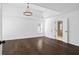 Large main bedroom with tray ceiling, hardwood floors, and ensuite bathroom at 2130 Waters Ferry Dr, Lawrenceville, GA 30043