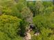 Aerial view of home nestled within a beautiful, mature tree canopy at 2977 Glover Dr, Cumming, GA 30040