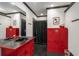 Unique bathroom featuring dual sinks, lockers and black tiled shower for a distinctive and functional space at 2977 Glover Dr, Cumming, GA 30040