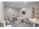 Bathroom with free-standing tub, tiled floor, and decorative shelving at 2977 Glover Dr, Cumming, GA 30040