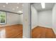 Bonus room with hardwood flooring and neutral walls, attached to a separate storage area at 2977 Glover Dr, Cumming, GA 30040