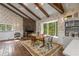 Charming dining area boasts a stone fireplace, natural light, and wood floors at 2977 Glover Dr, Cumming, GA 30040