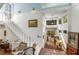 Spacious entryway with staircase, brick floors, and large windows providing ample natural light at 2977 Glover Dr, Cumming, GA 30040