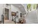 Grand entryway with elegant staircase, tile floors, and ample natural light from the large arched windows at 2977 Glover Dr, Cumming, GA 30040