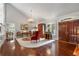 Wide foyer boasts hardwood floors, bright walls, and a chandelier at 2977 Glover Dr, Cumming, GA 30040