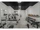 Well-equipped home gym featuring modern lighting and a full range of weightlifting equipment for a complete fitness experience at 2977 Glover Dr, Cumming, GA 30040