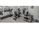 Home gym featuring a treadmill, weight machines, mirrored walls, and ample space for a comprehensive workout at 2977 Glover Dr, Cumming, GA 30040