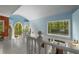 Bright hallway with arched windows, white railing, and colorful walls, offering a view of the lower level at 2977 Glover Dr, Cumming, GA 30040