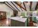 Spacious kitchen featuring a large island, stone fireplace, and wood floors at 2977 Glover Dr, Cumming, GA 30040