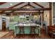Bright, open kitchen with a large island, wood floors, and charming decor at 2977 Glover Dr, Cumming, GA 30040
