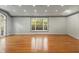 Inviting living room features hardwood floors, a bay window, and ample natural light at 2977 Glover Dr, Cumming, GA 30040