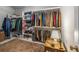 Organized walk-in closet featuring custom shelving, hanging rods, and an elegant area rug, providing ample storage space at 2977 Glover Dr, Cumming, GA 30040