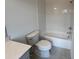 Bathroom featuring subway tile, tub and marble countertop at 623 Silva St # 130, Cumming, GA 30040