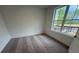 Well-lit bedroom featuring a large window with nice outdoor views at 623 Silva St # 130, Cumming, GA 30040