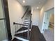 Entryway featuring stairs and a hallway leading to a bathroom and the rest of the home at 623 Silva St # 130, Cumming, GA 30040