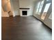 Open living room with fireplace and patio doors leading to a deck area at 623 Silva St # 130, Cumming, GA 30040