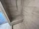 Inside the modern bathroom featuring a walk-in shower with a built-in tiled bench seating at 623 Silva St # 130, Cumming, GA 30040