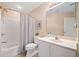 Well-maintained bathroom with shower/tub combo, white vanity, and neutral decor at 12103 Windrush Ln, Alpharetta, GA 30009