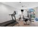 On-site fitness center featuring modern exercise equipment and natural light at 12103 Windrush Ln, Alpharetta, GA 30009