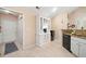 Functional kitchen with granite countertops, stainless appliances, and built-in hutch, conveniently located near the laundry area at 12103 Windrush Ln, Alpharetta, GA 30009