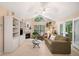 Inviting living room featuring a fireplace, built-in shelving, and sliding doors to the outside at 12103 Windrush Ln, Alpharetta, GA 30009