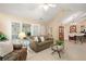 Spacious living room with sliding doors, vaulted ceilings, and open layout at 12103 Windrush Ln, Alpharetta, GA 30009
