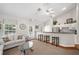 Comfortable lounge area featuring lots of natural light, bar seating and modern decor at 12103 Windrush Ln, Alpharetta, GA 30009