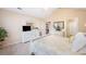 Spacious main bedroom features a white dresser, neutral carpet, and an attached bathroom and closet at 12103 Windrush Ln, Alpharetta, GA 30009