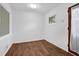 A spacious bedroom features a window with natural light, hardwood floors, and a door to the backyard at 4222 Webb Rd, Tucker, GA 30084