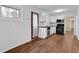 The modernized kitchen features white cabinets, stainless steel appliances, and views of the yard at 4222 Webb Rd, Tucker, GA 30084