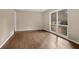 Bright living room featuring hardwood floors, fresh paint, and a large window overlooking the front yard at 4222 Webb Rd, Tucker, GA 30084