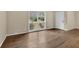 Inviting living room with gleaming hardwood floors, neutral walls, and ample natural light from the large window at 4222 Webb Rd, Tucker, GA 30084