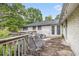 Spacious back deck with metal furniture, accessible through double doors, great for outdoor relaxation at 8600 Andy Mountain Ct, Villa Rica, GA 30180