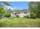 A one-story brick house featuring a well-maintained lawn and lush greenery at 8600 Andy Mountain Ct, Villa Rica, GA 30180