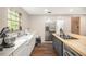 Modern kitchen features stainless appliances, a kitchen island and countertops at 8600 Andy Mountain Ct, Villa Rica, GA 30180
