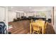 Open floor plan featuring hardwood floors, kitchen island, dining area, and comfortable seating at 8600 Andy Mountain Ct, Villa Rica, GA 30180