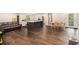 Spacious living room features hardwood floors, kitchen, and dining area in an open-concept design at 8600 Andy Mountain Ct, Villa Rica, GA 30180