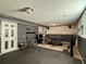 Finished basement provides a versatile area for recreation, fitness, or hobbies at 1902 Mack Rd, Douglasville, GA 30135