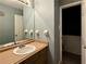 Bathroom featuring a single sink vanity and a large mirror at 1902 Mack Rd, Douglasville, GA 30135