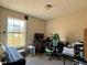 Spare bedroom with a large window and desk with a computer at 1902 Mack Rd, Douglasville, GA 30135